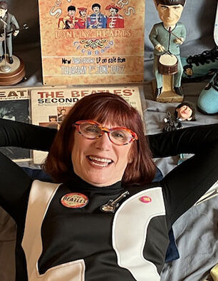 Author Laurie Jacobson surrounded by some of her Beatles memorabilia photo- credit Jon Provost