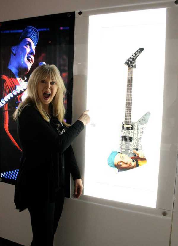 Shannon with one of Rick Nieldsens guitars she painted for him